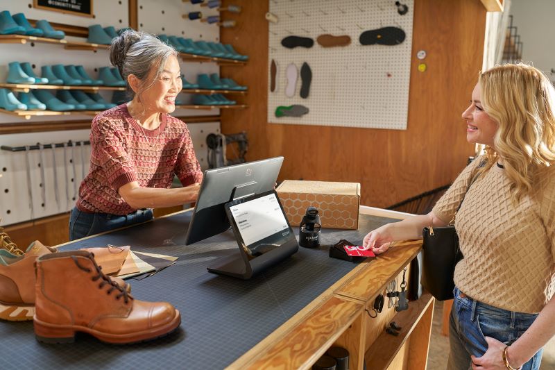 Woman serving retail customer 