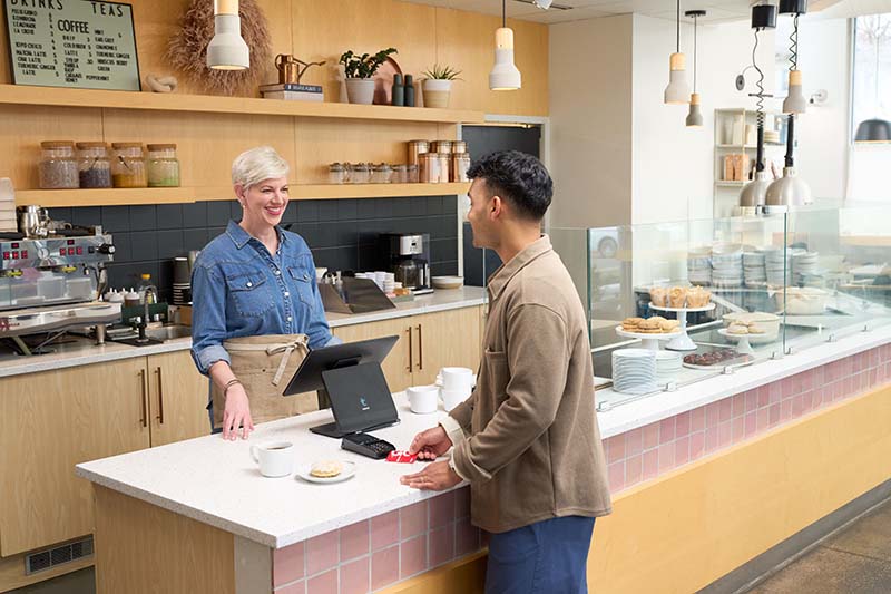 Restaurant owner taking a credit card payment