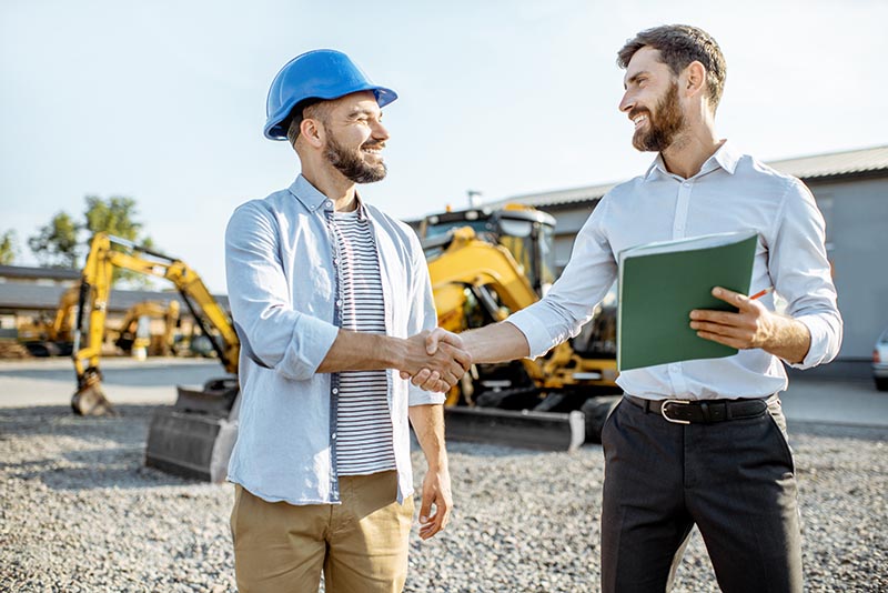 Construction foreman renting heavy equipment.