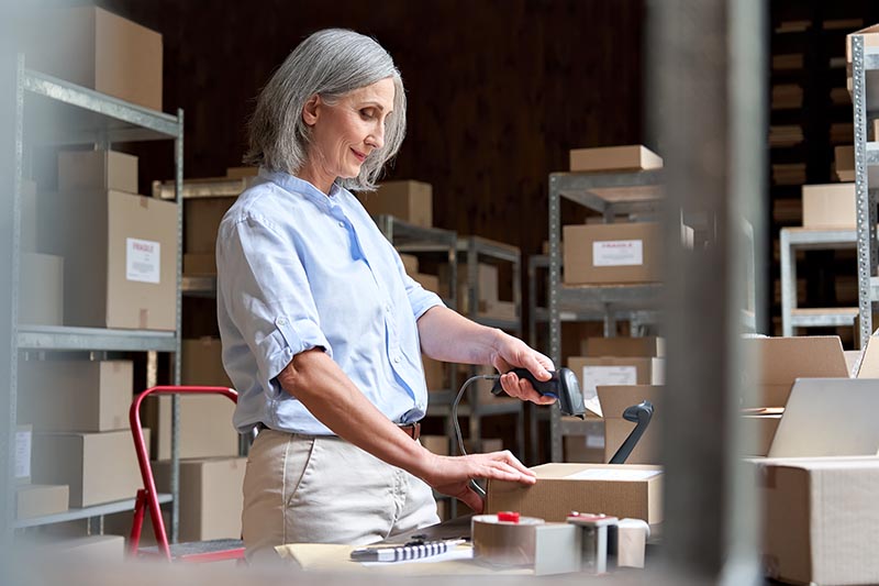 Small business owner packing sale orders. 